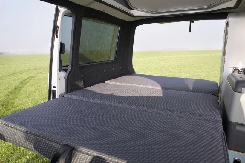 The Tonke Van's rear seats fold into a mattress