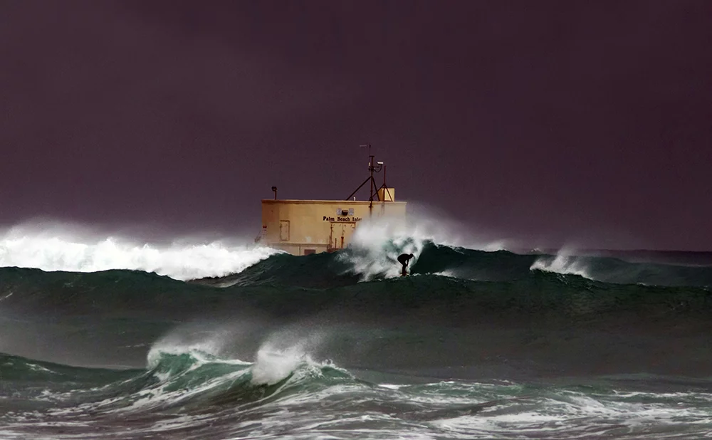 Nominee, Professional, Nature. A surfer during a tropical storm in Palm Beach