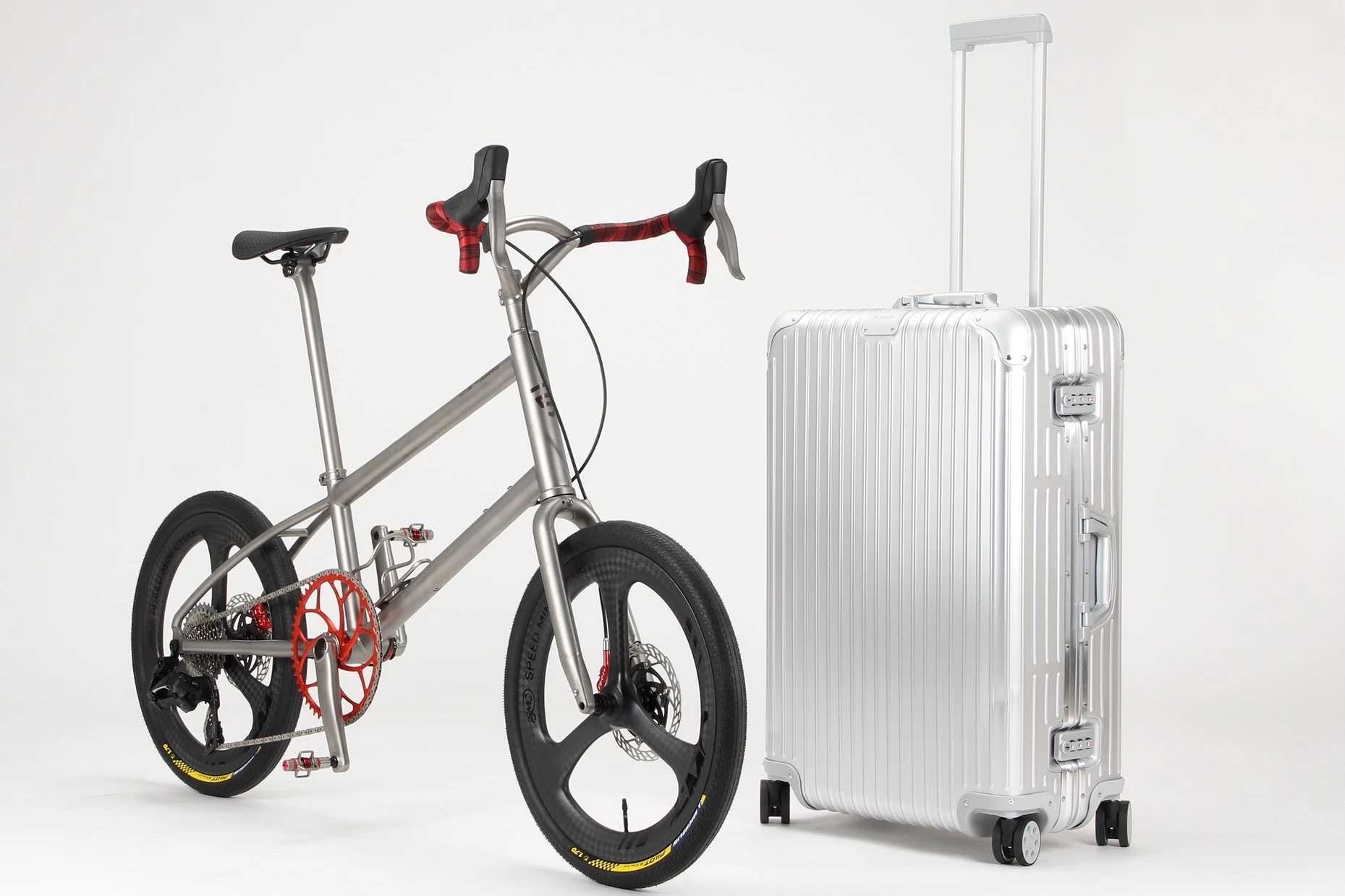 The Firefly MiniVelo alongside the suitcase that carries it