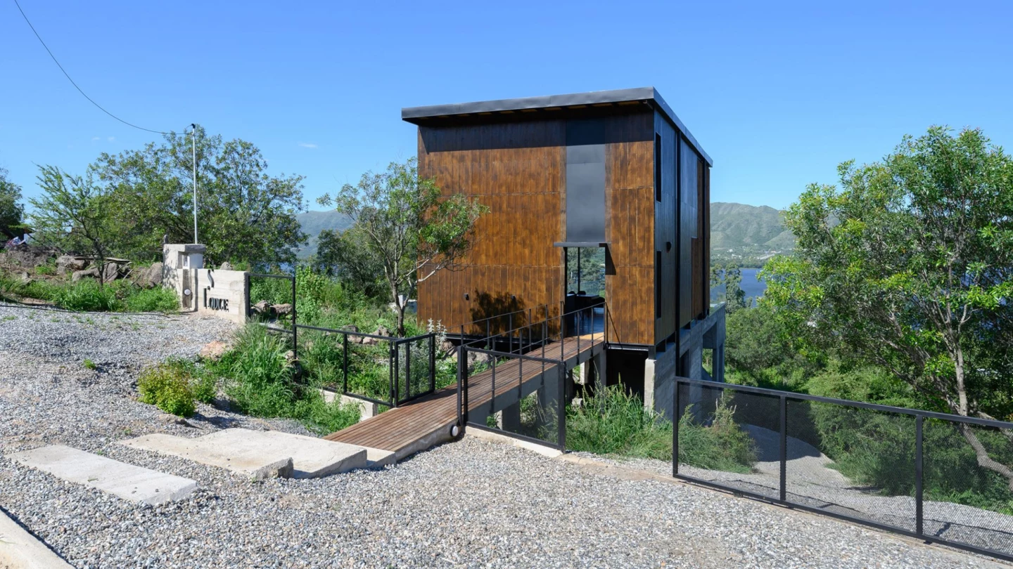 Siquiman Lodge is accessed via a footbridge