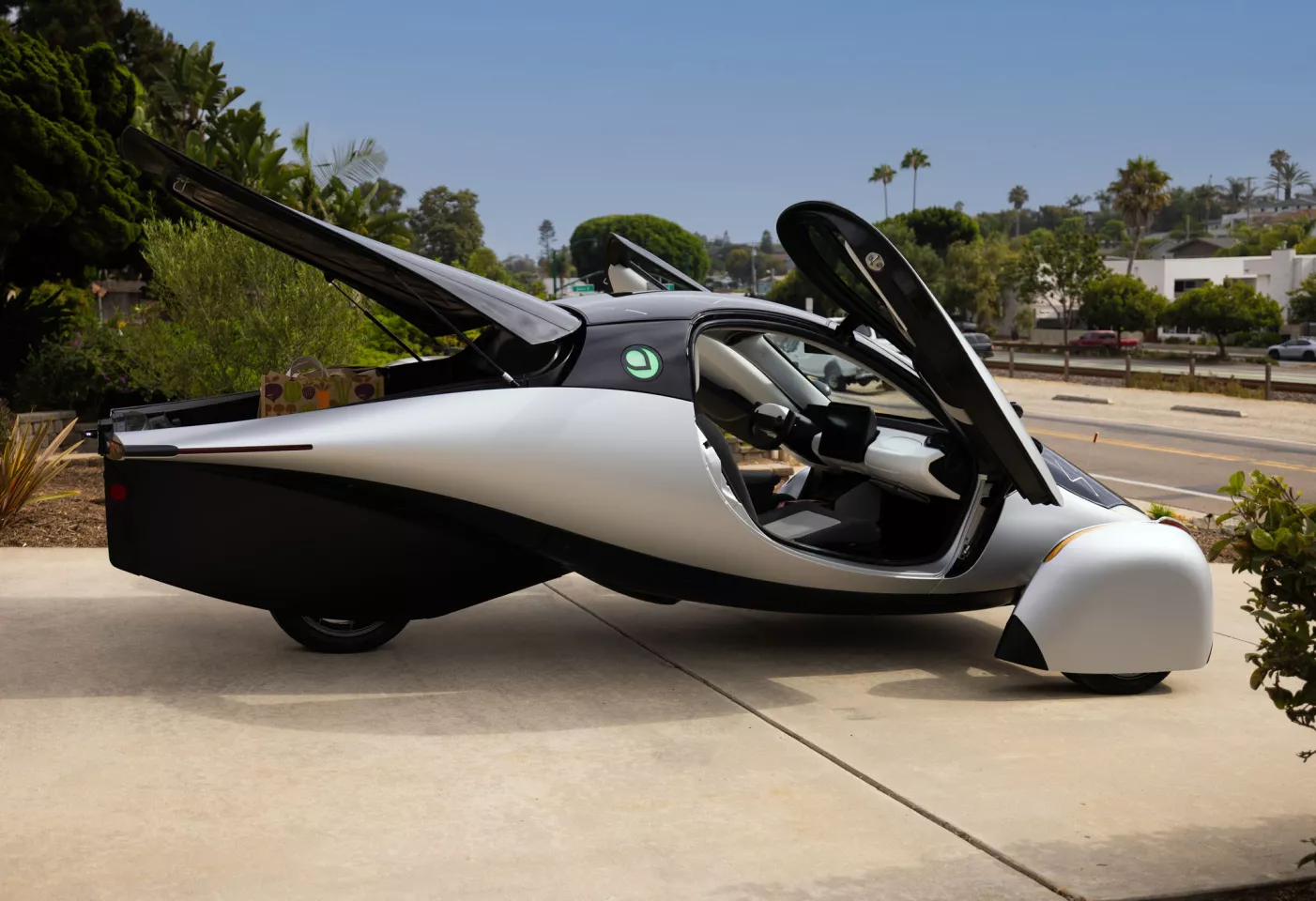 From the two gull-wing doors to the long thin luggage space, there’s nothing normal about this three-wheel solar car 
