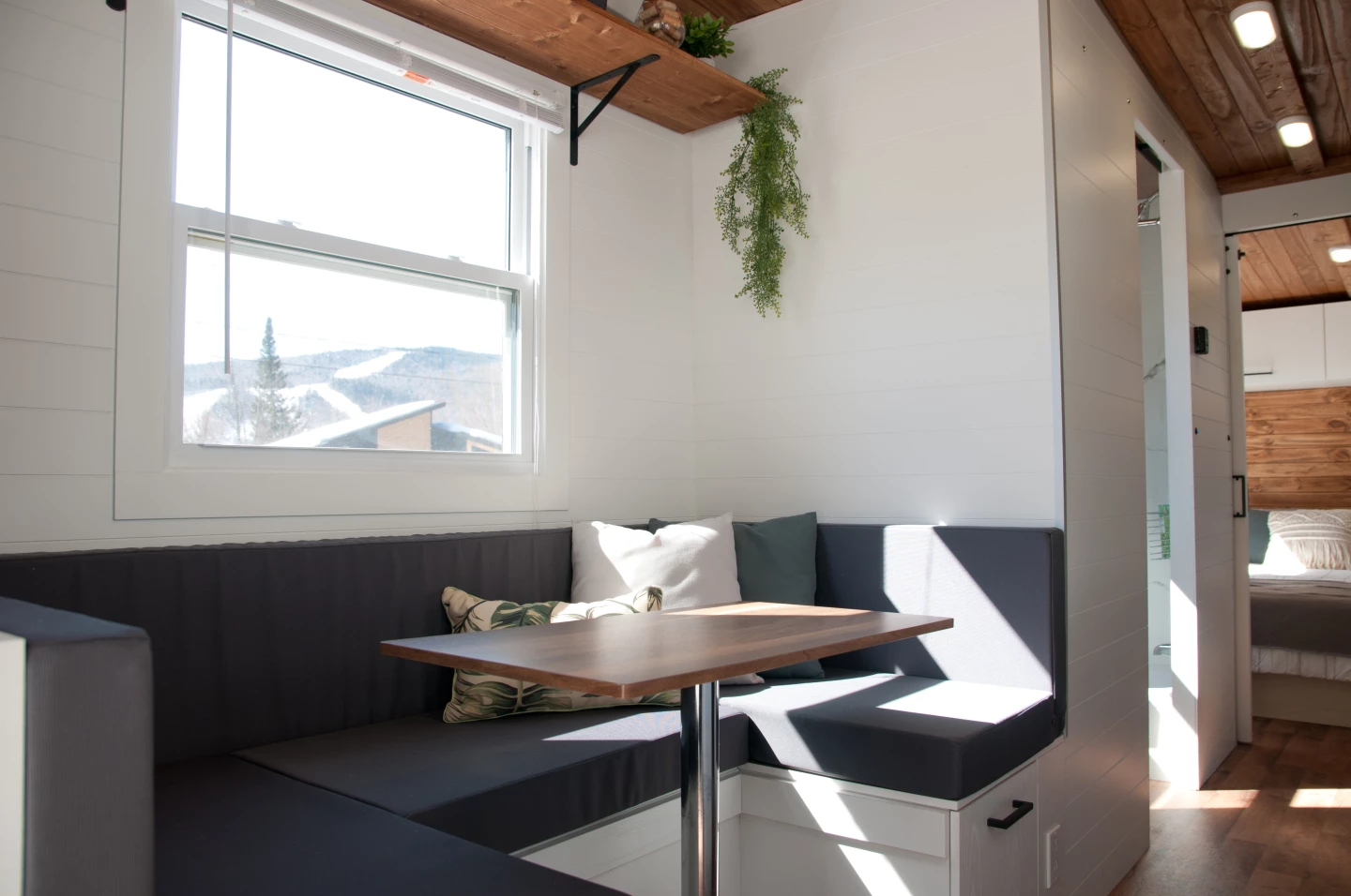 The Nomad's dining area seats four, with the U-shaped bench featuring integrated storage