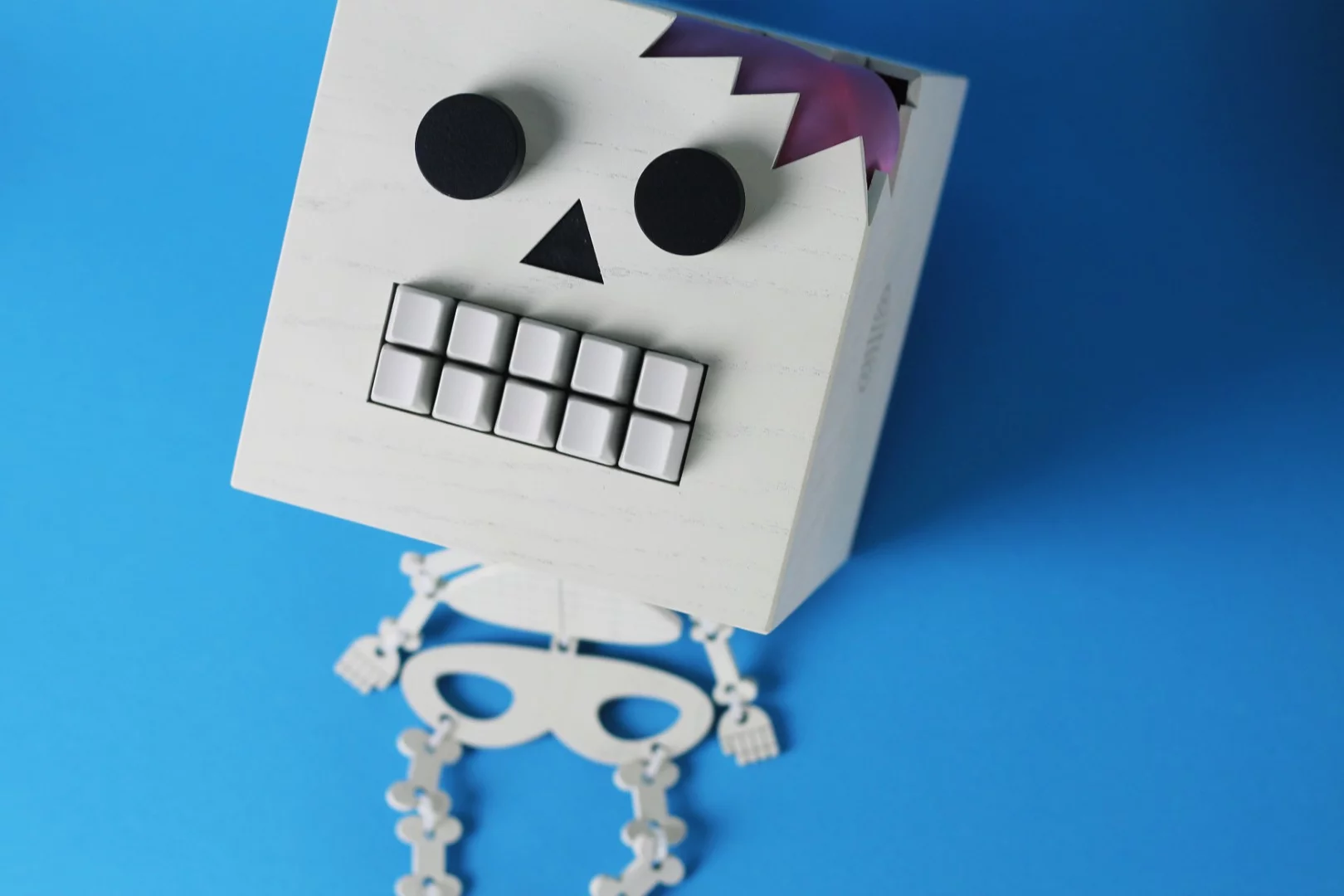 Mr Typo's spongy brain can be seen peeking through the cracked skull