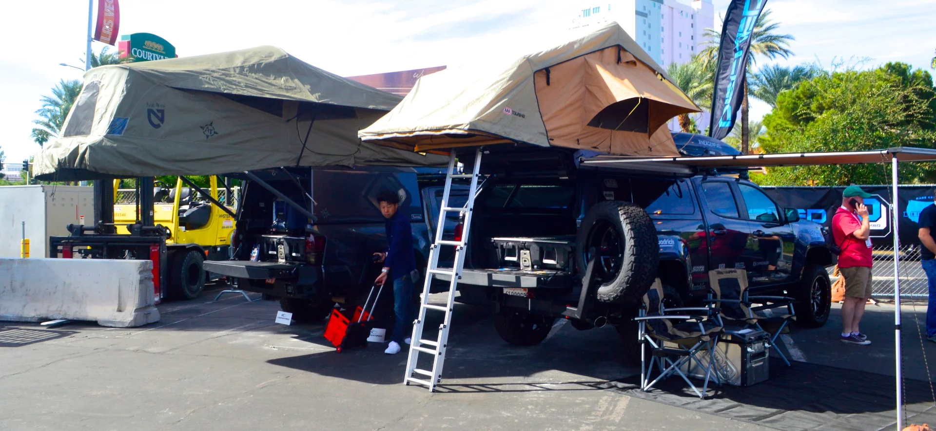 A pair of truck campers outside at SEMA