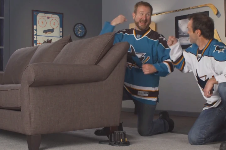 Gleeful Sharks fans install the Buttkicker Advance unit under their couch