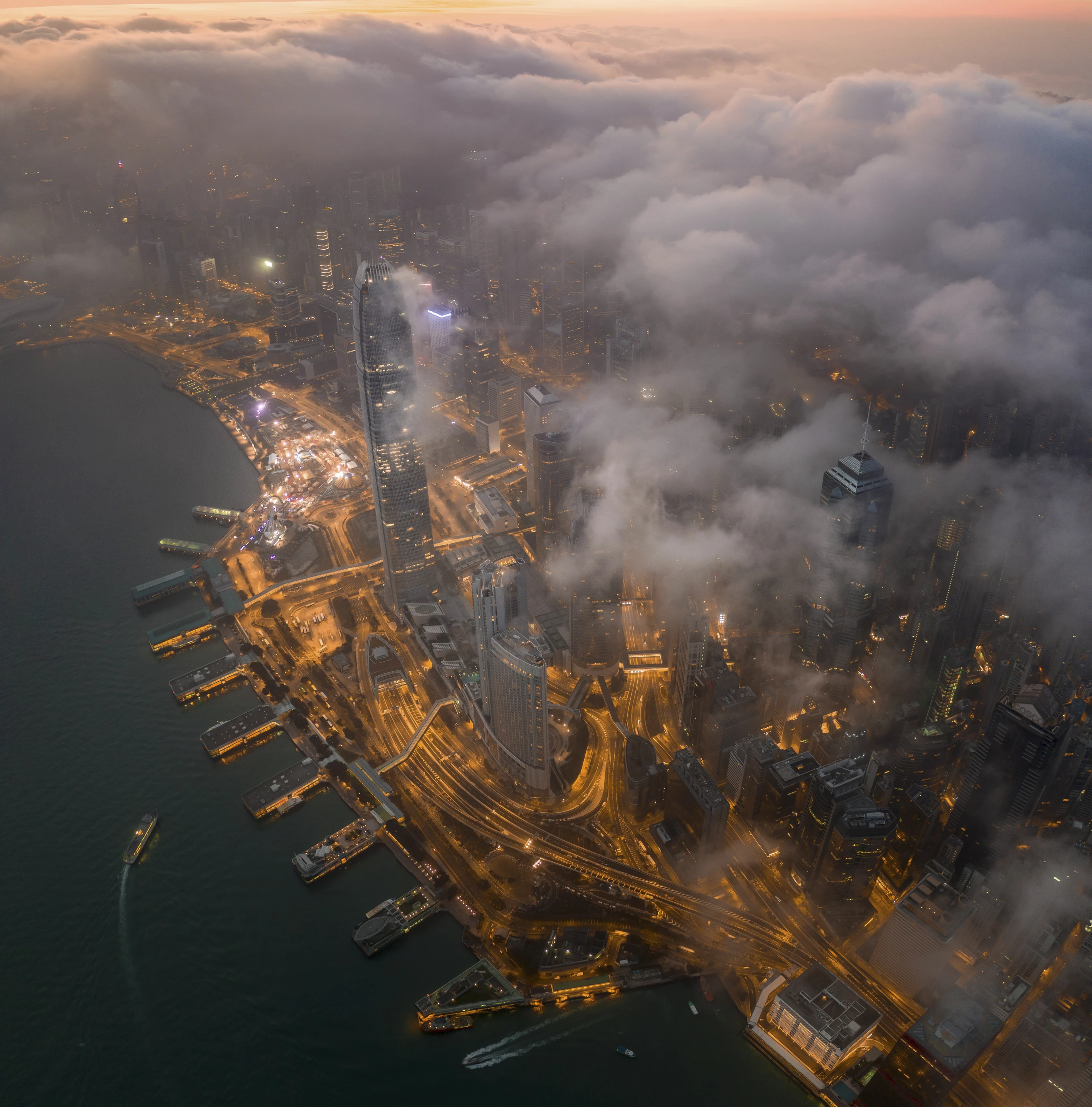 The view of the world famous Victoria Harbour (Hong Kong) under the clouds in the early morning.