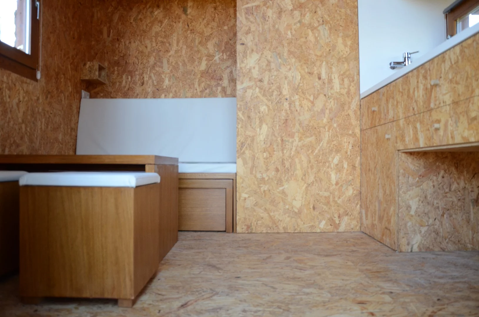 The Ecocubo includes a sofa bed, composting toilet, kitchenette and a couple of small seats that double up as storage space