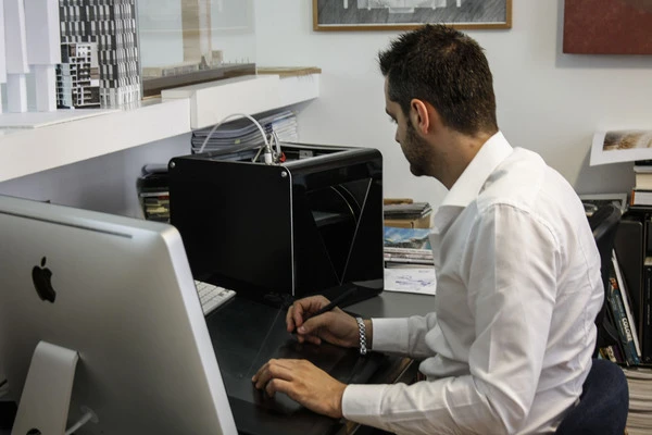 A FABtotum and one of the designers, Giovanni Grieco