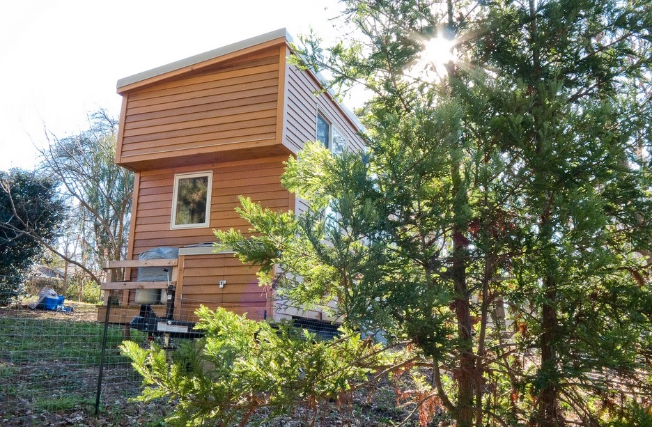 The wooden homes blends into its environment