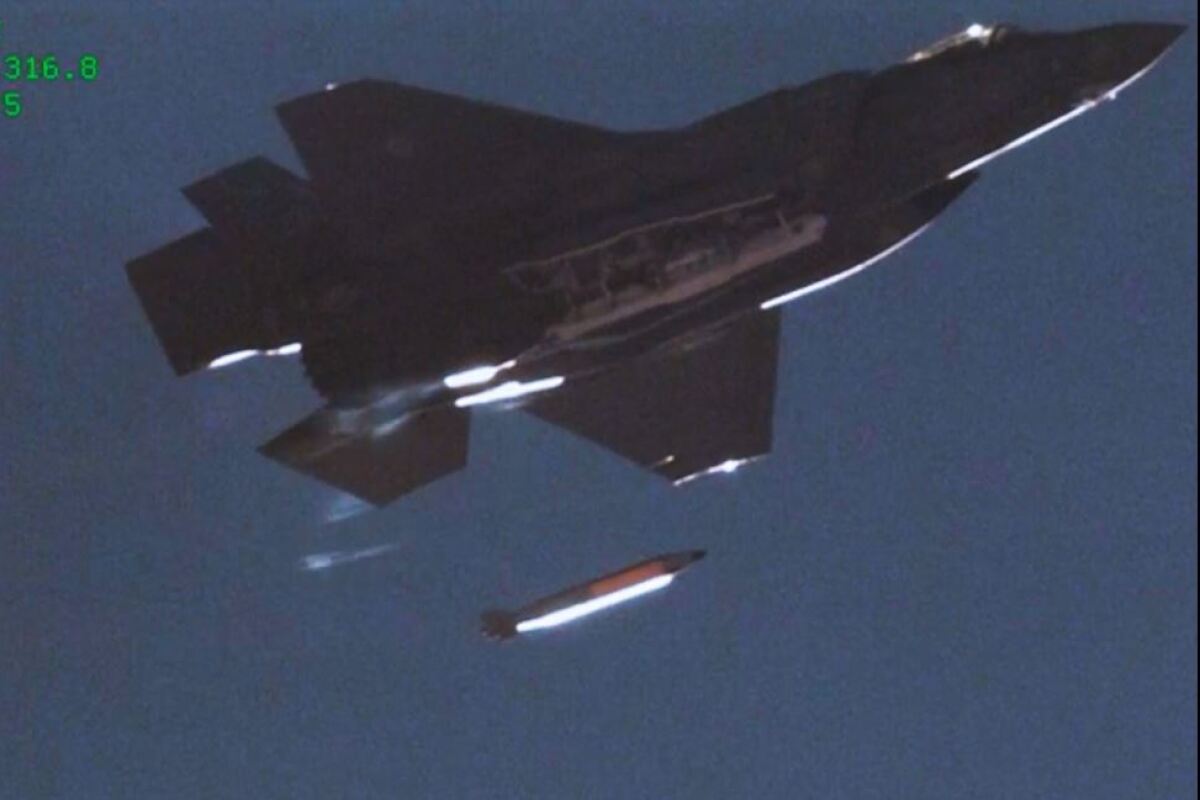 An F-35A Lightning II fighter dropping a B61-12 mock nuclear bomb