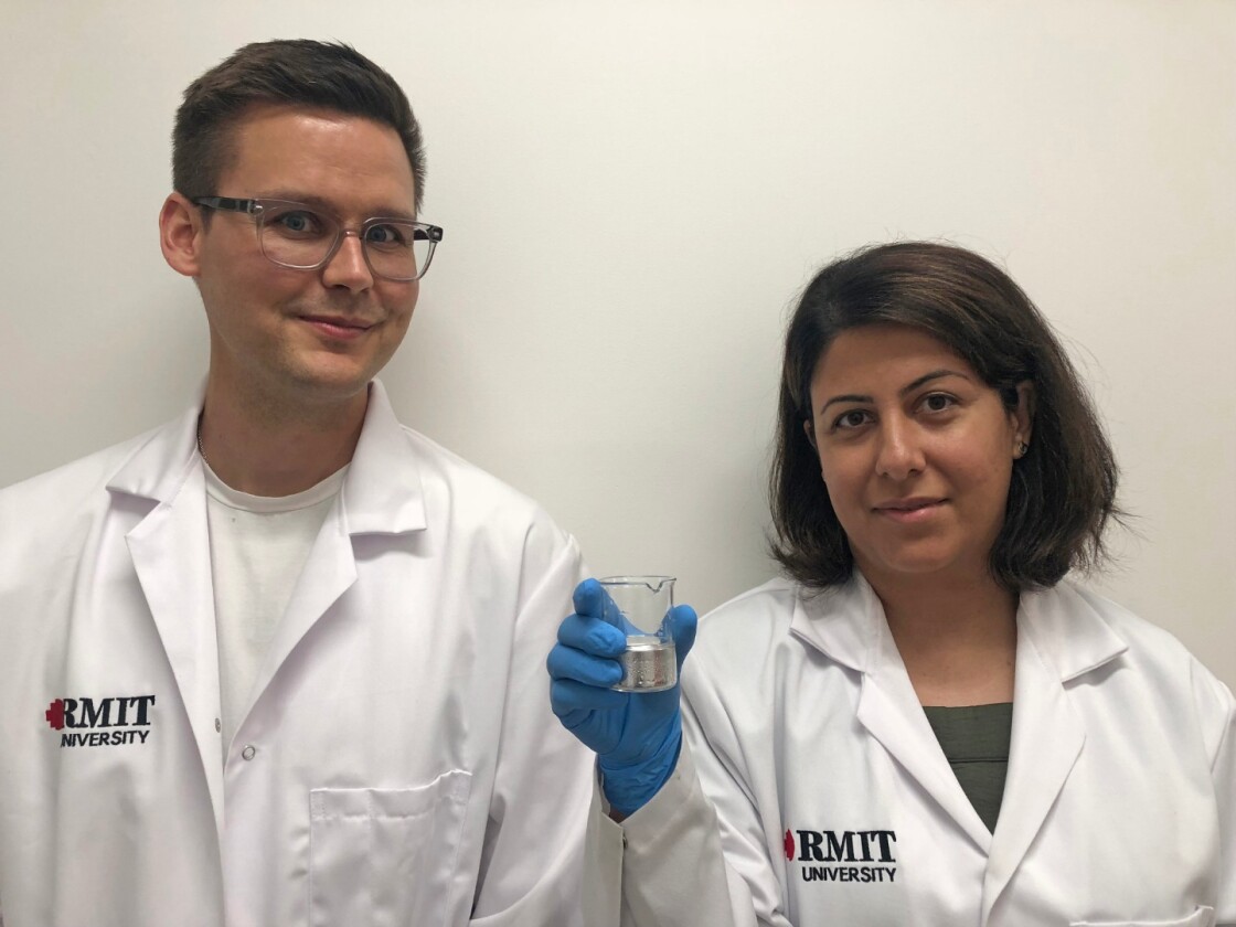 RMIT researchers Torben Daeneke (left) and Dorna Esrafilzadeh (right) with a sample of the liquid metal catalyst