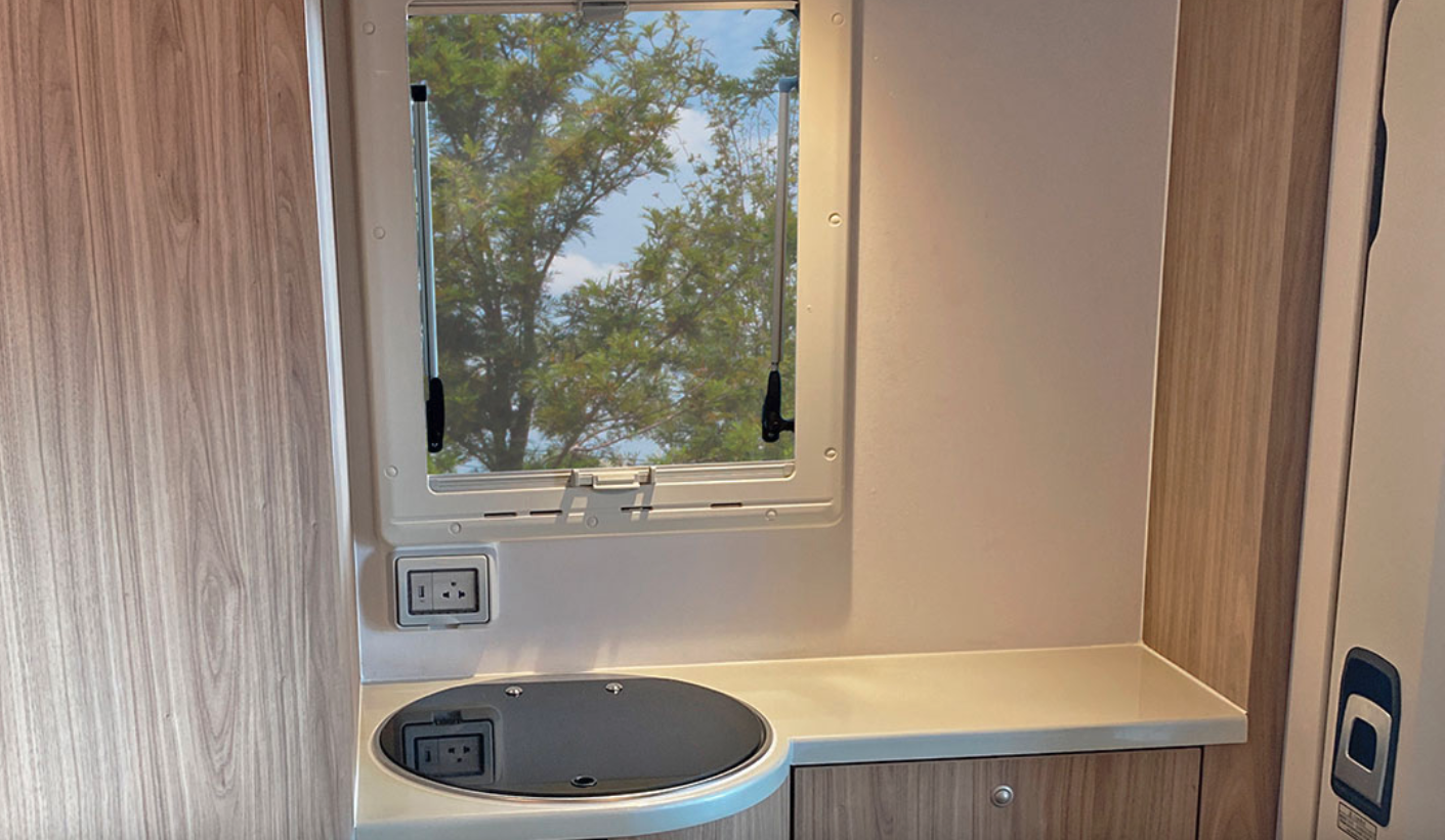 Carryboy offers the option of the bathroom-adjacent sink with a counter to the right or a wardrobe