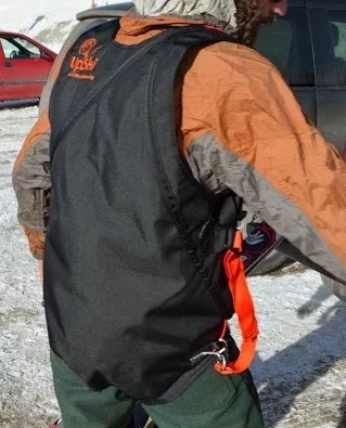 The UpSki rider controls the wind sail with help from the included harness