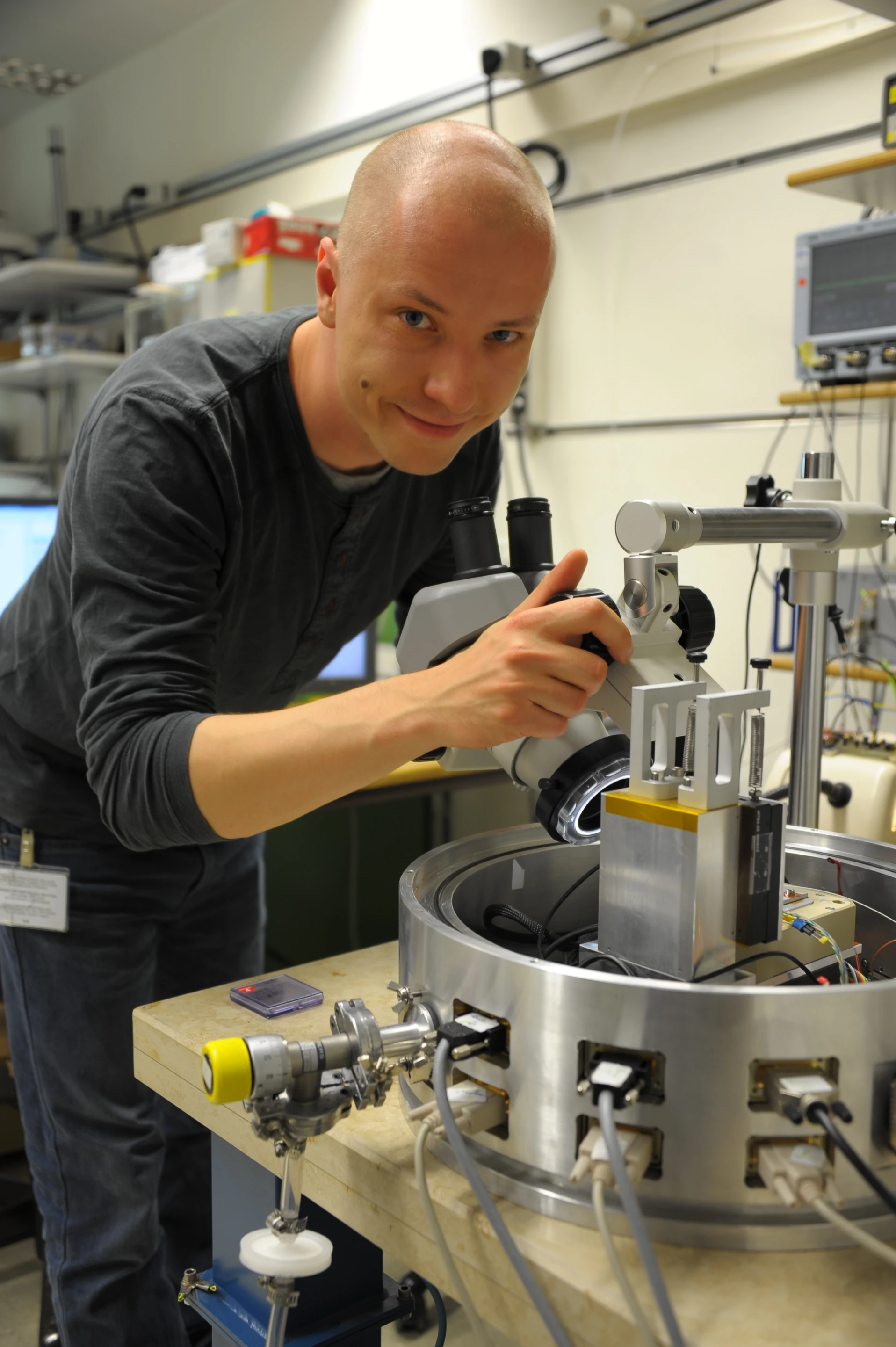 IBM scientist Michal Zientek makes adjustments to nanopatterning tool