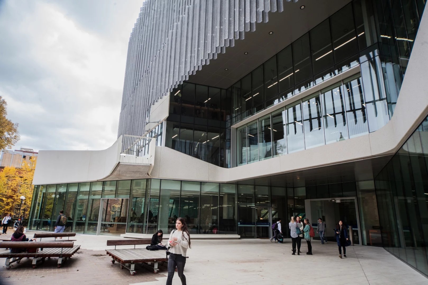 Perforated zinc sunshades shield the north, east and west sides of the building, resting a foot or so out from the building's exterior