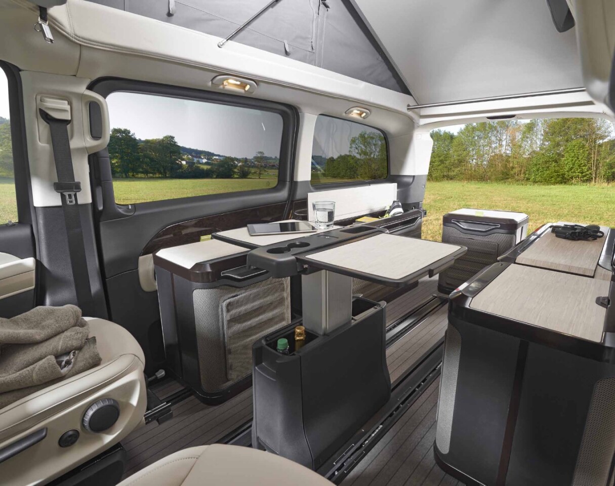 What serves as a thin, sleek storage console on the ride becomes a table at camp