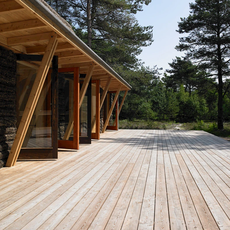 The Modern Seaweed House features a large outdoor deck