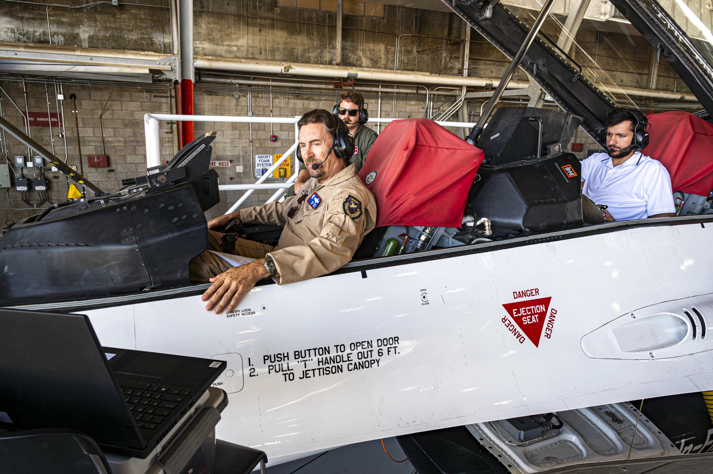 William Gray, Chief Test Pilot, USAFTPS, and other engineers conduct software updates to the X-62 VISTA