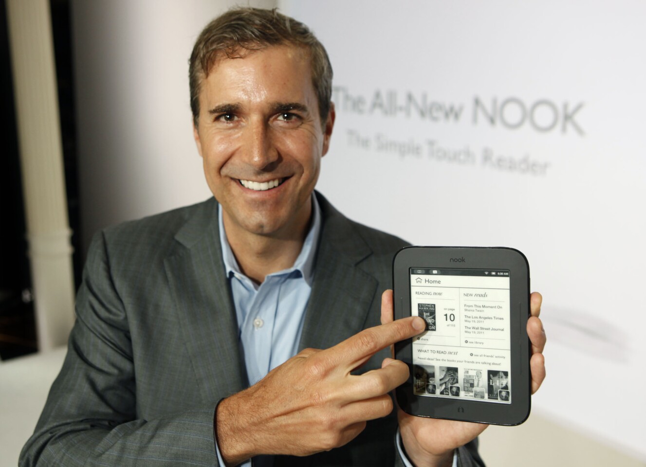 William Lynch, Chief Executive Officer of Barnes & Noble, with the Nook Simple Touch Reader