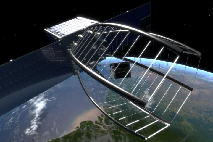 CleanSpace One uses its net to envelope the SwissCube satellite