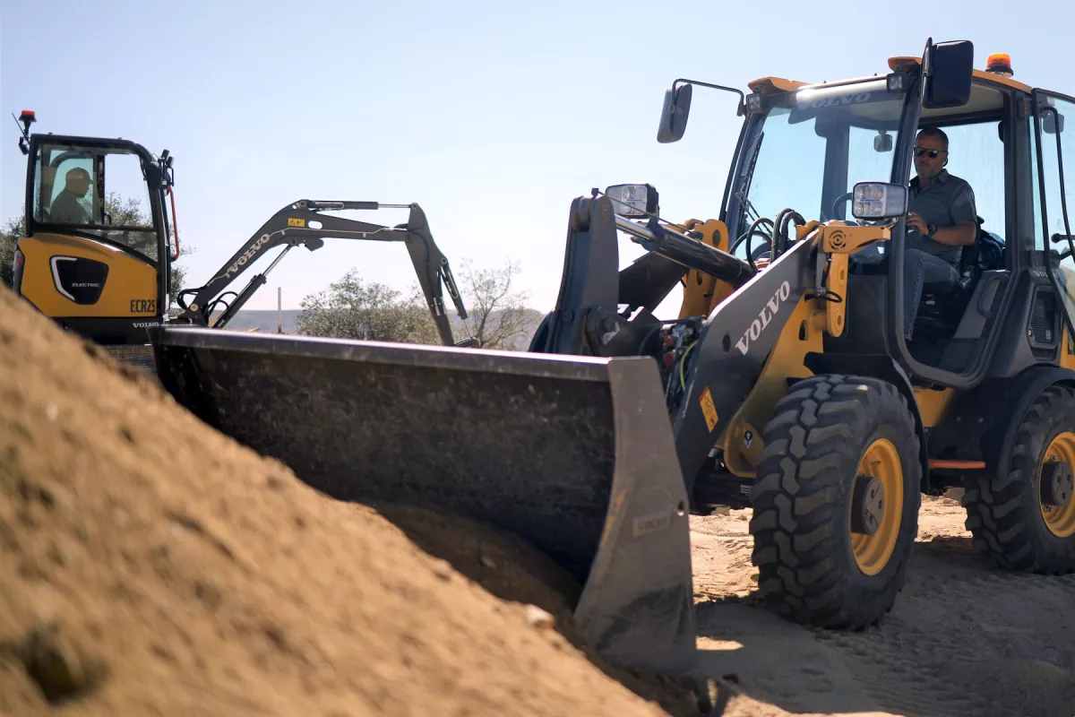 The ECR25 Electric compact excavator (left) and the L25 compact wheel loader (right) are up for pre-order now