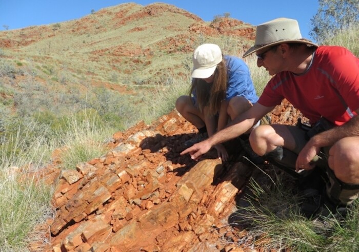 The researchers investigate rock formations in the Pilbara region