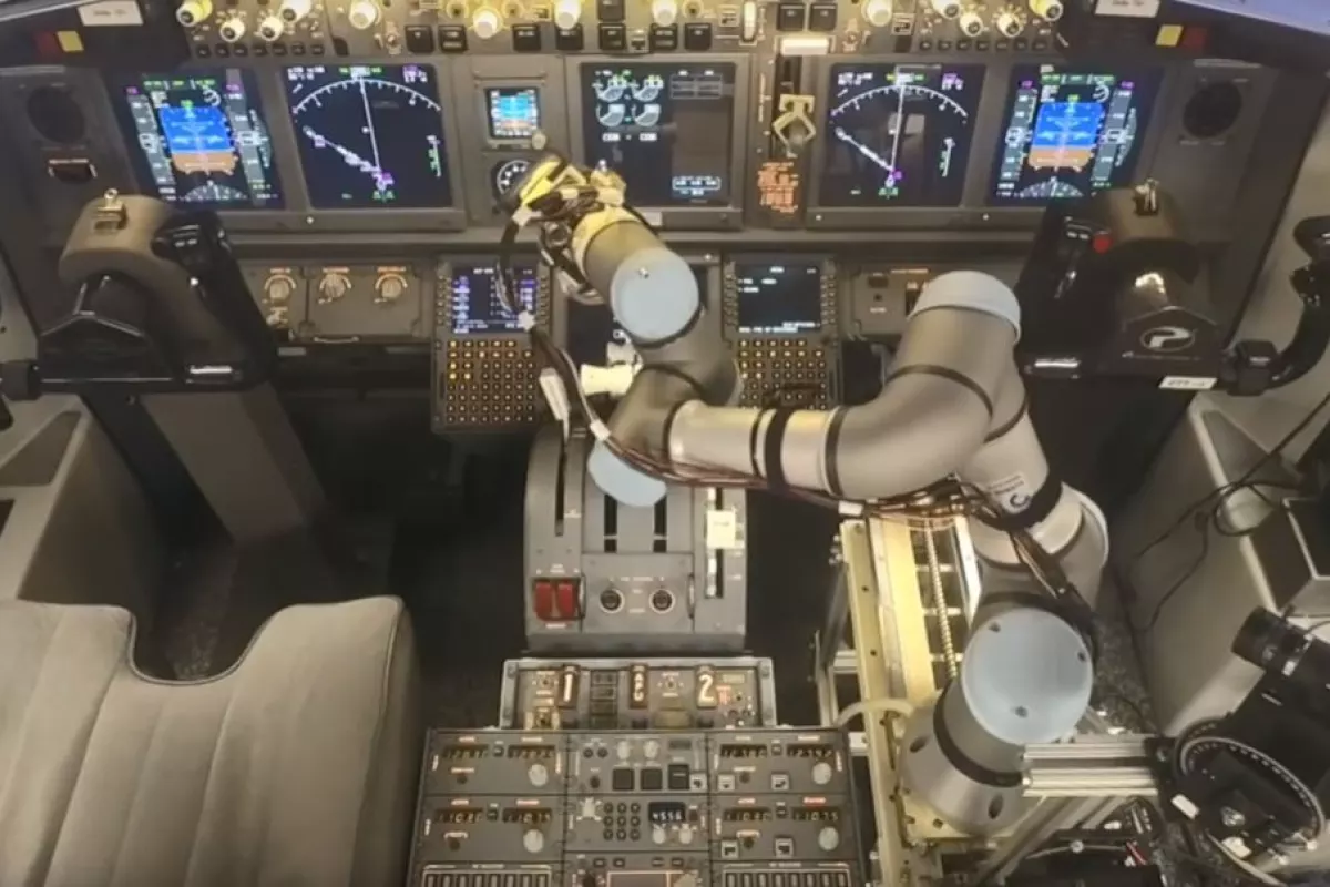 The ALIAS system operating the 737 controls using a robotic arm