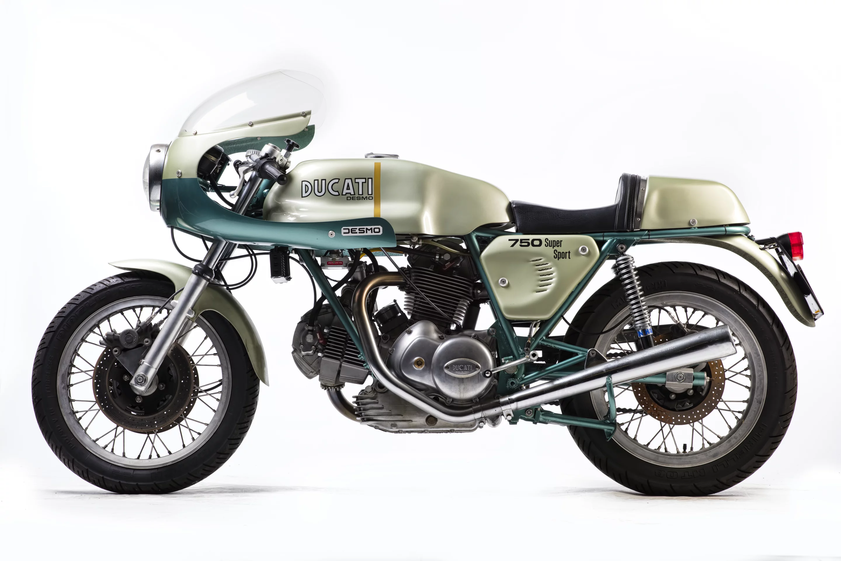 Slightly compromised in that it is not a matching numbers bike, the bike is regardless one of the original 401 examples of the green-framed 72 hp Desmo 750 SS which was produced to celebrate the Ducati 1-2 victory of Paul Smart and Bruno Spaggiari in the 1972 Imola 200 Mile race. That non-matching engine number cut $100,000 from the price, as a new world record for the 750 SS was achieved just a month ago when Gooding & Company sold a near identical 1974 Ducati 750 Supersport for $176,000, beating out the previous record of $152,885 (sold for €114,371) set at the Paris Retromobile auctions in February, 2013 by Artcurial. The bike (Lot 574) sold for £52,900 ($68,923).