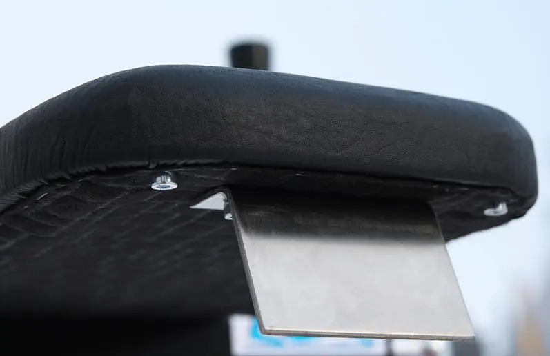 The braking system is located on the underside of the seat (older version)