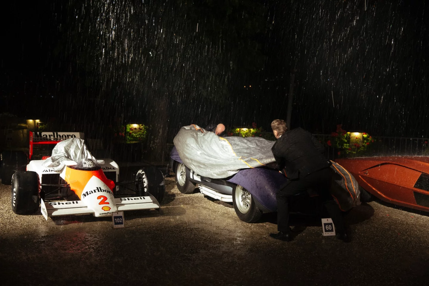 Andreas Mohringer's 1958 Ferrari 335 Sport Spider got caught in the rain without a cover during the black tie awards dinner.