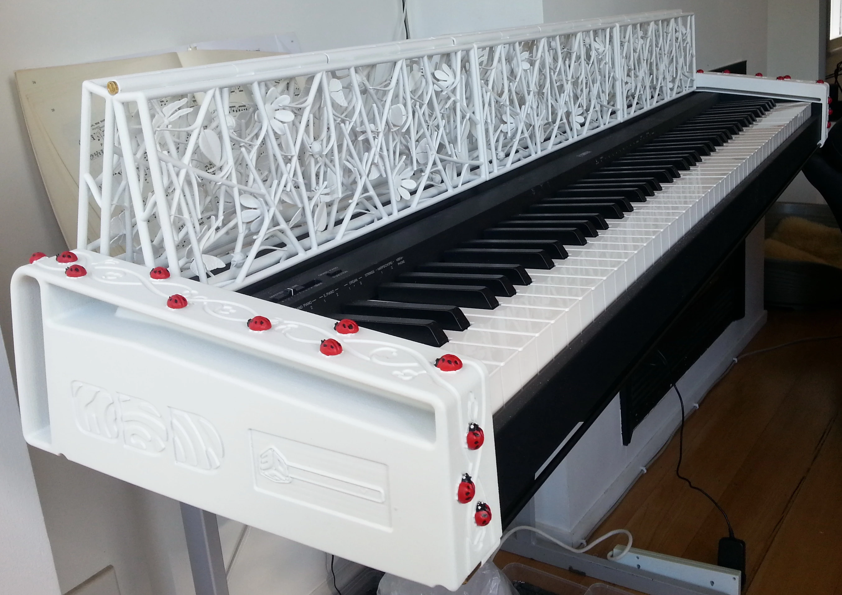 An army of ladybugs marches up and over the side of the keyboard