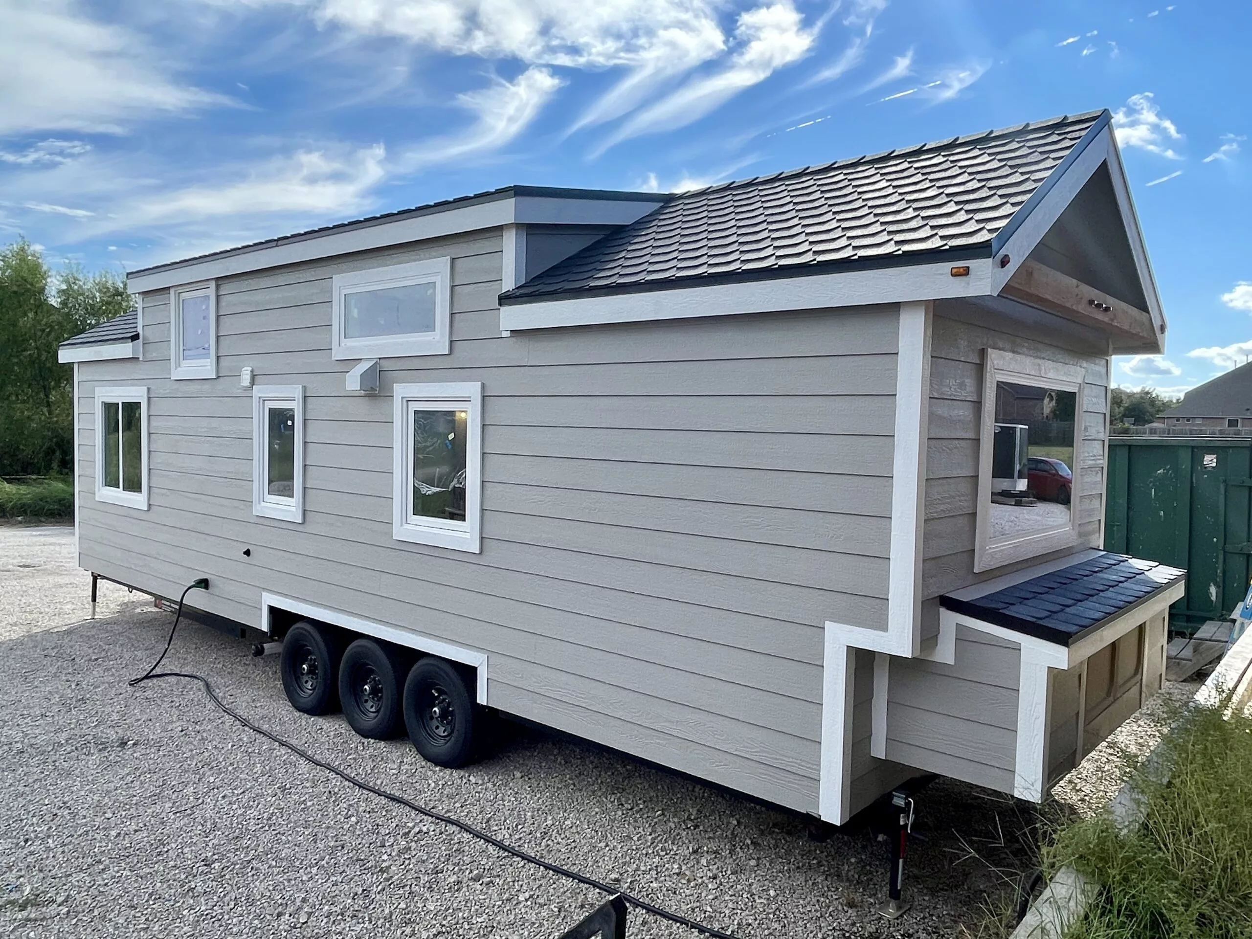 The New Chapter's exterior includes a storage box for propane gas bottles and tools, etc