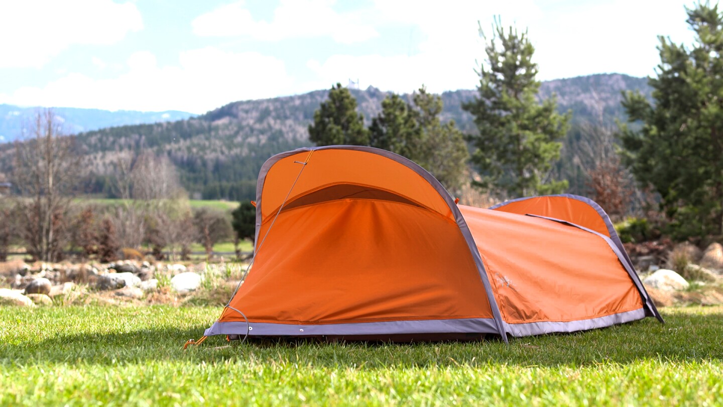 The Flying Tent stakes quickly, making a one-person tent with mosquito netting and rain fly