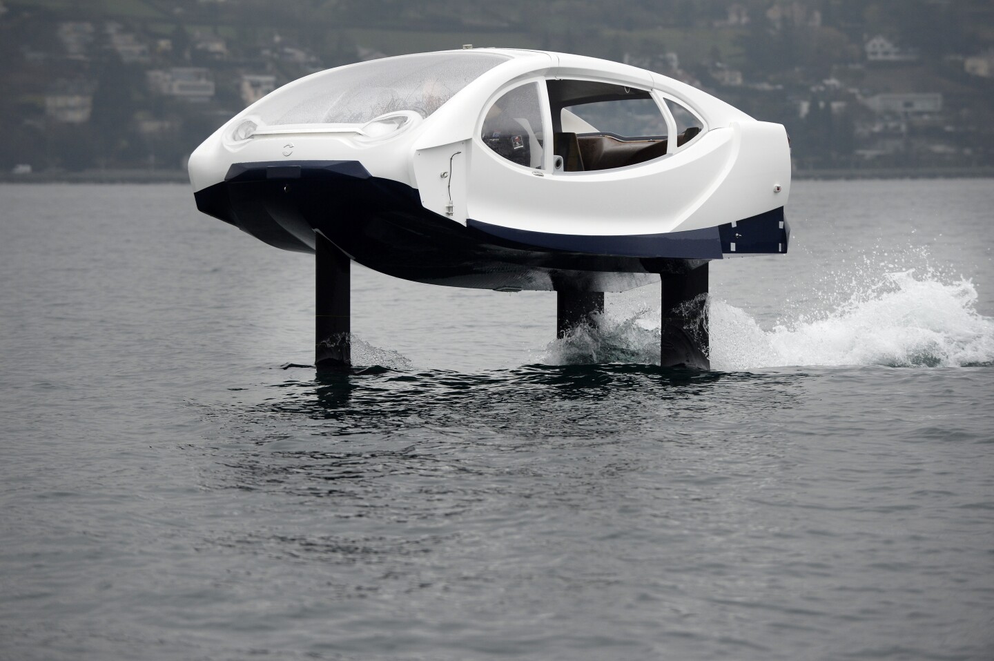 Riding high: this electric hydrofoiling bubble sits some 18 inches over the water