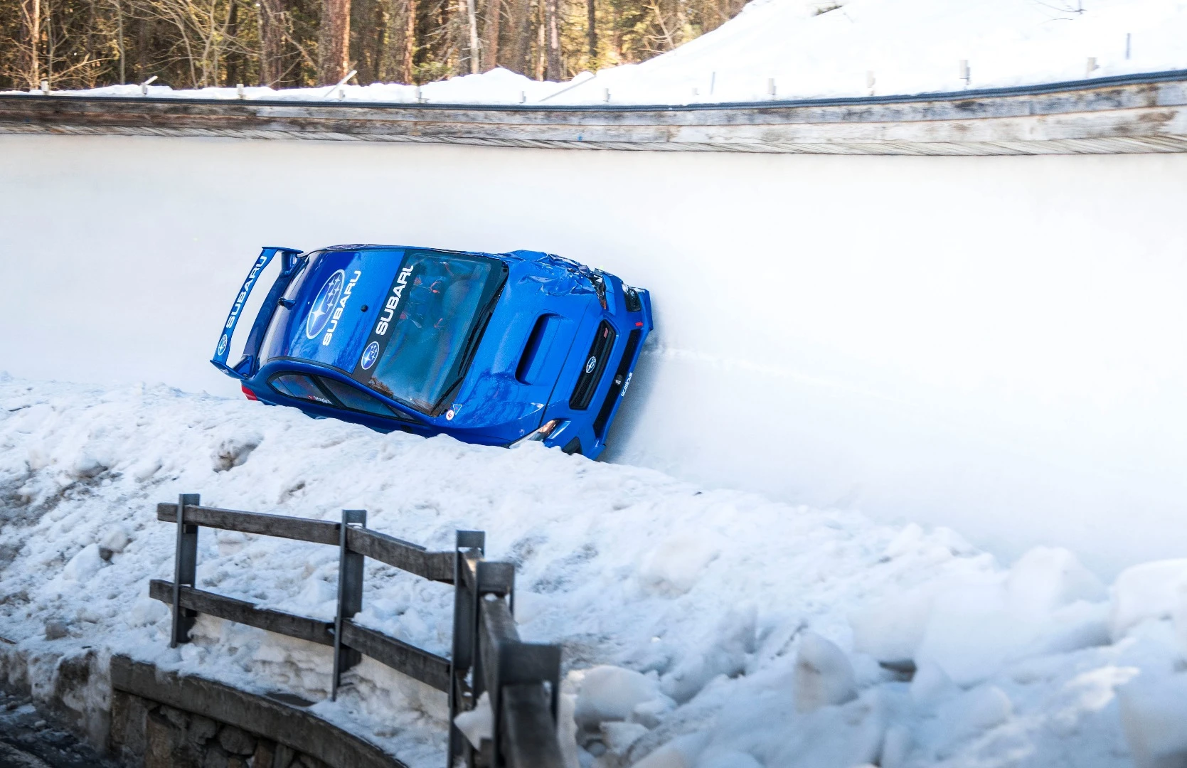 The iconic bonnet scoop of the WRX pokes out of the bobsled run in St. Moritz