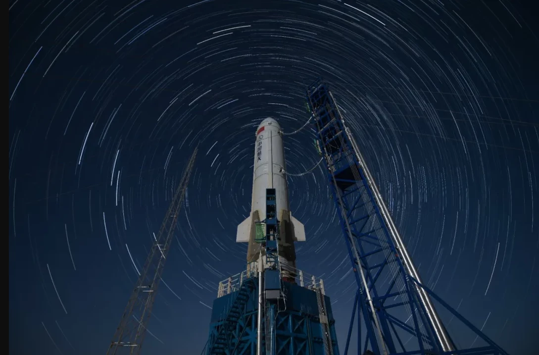 Time lapse photo showing stars revolving around the launch pad