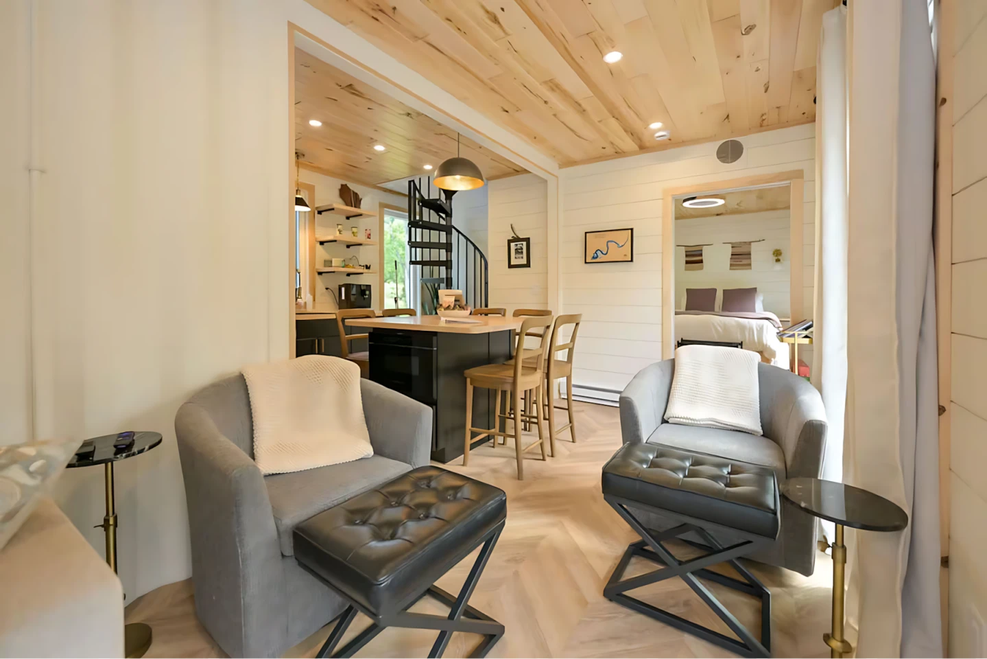 Maison Flambeau's living room includes a sofa bed and two chairs
