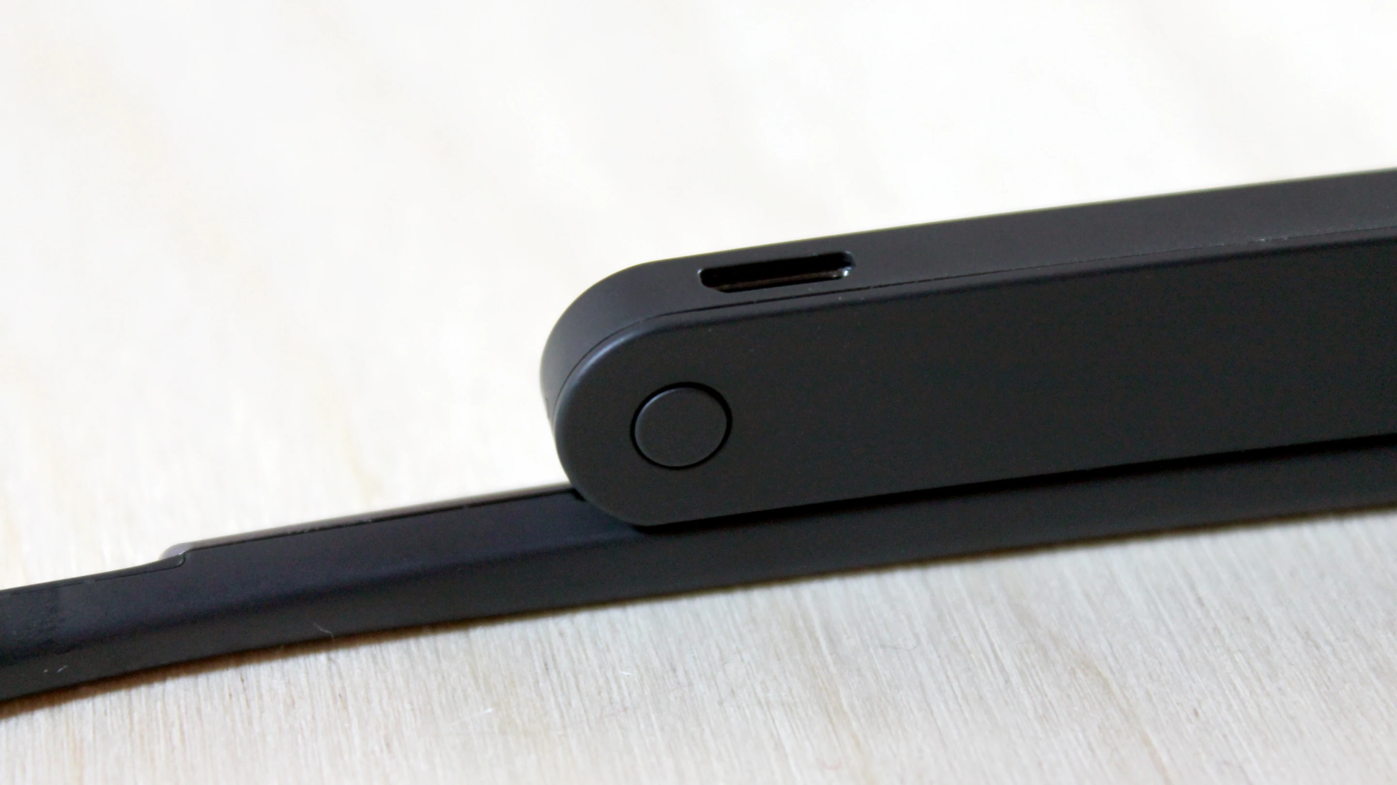That's Glass' power button, sitting below the micro-USB port
