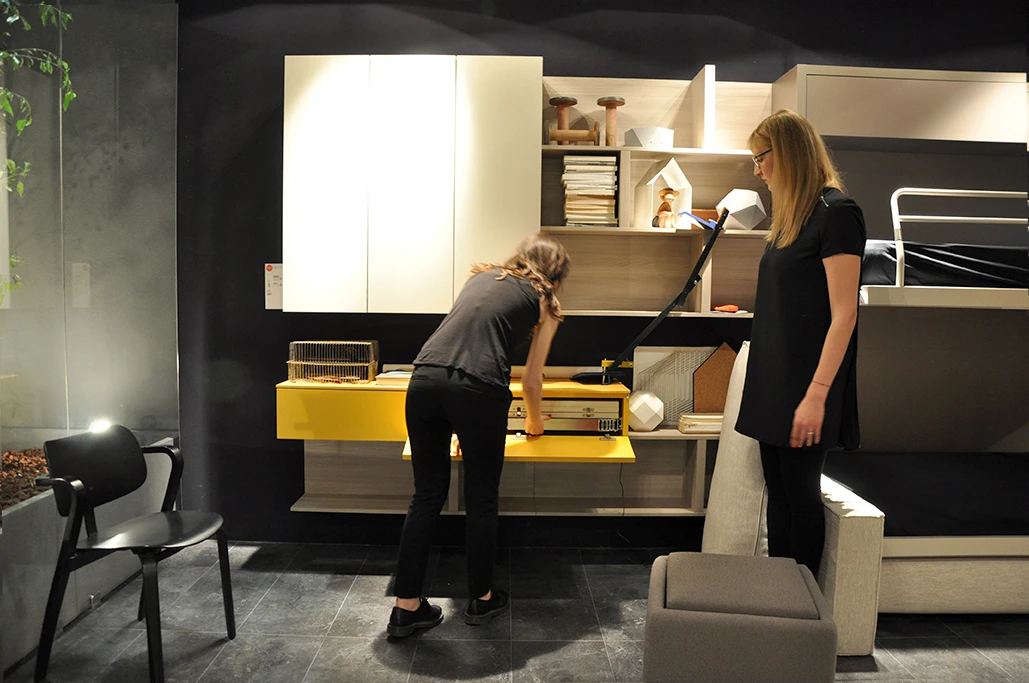 The hidden table gets pulled out from its shelving