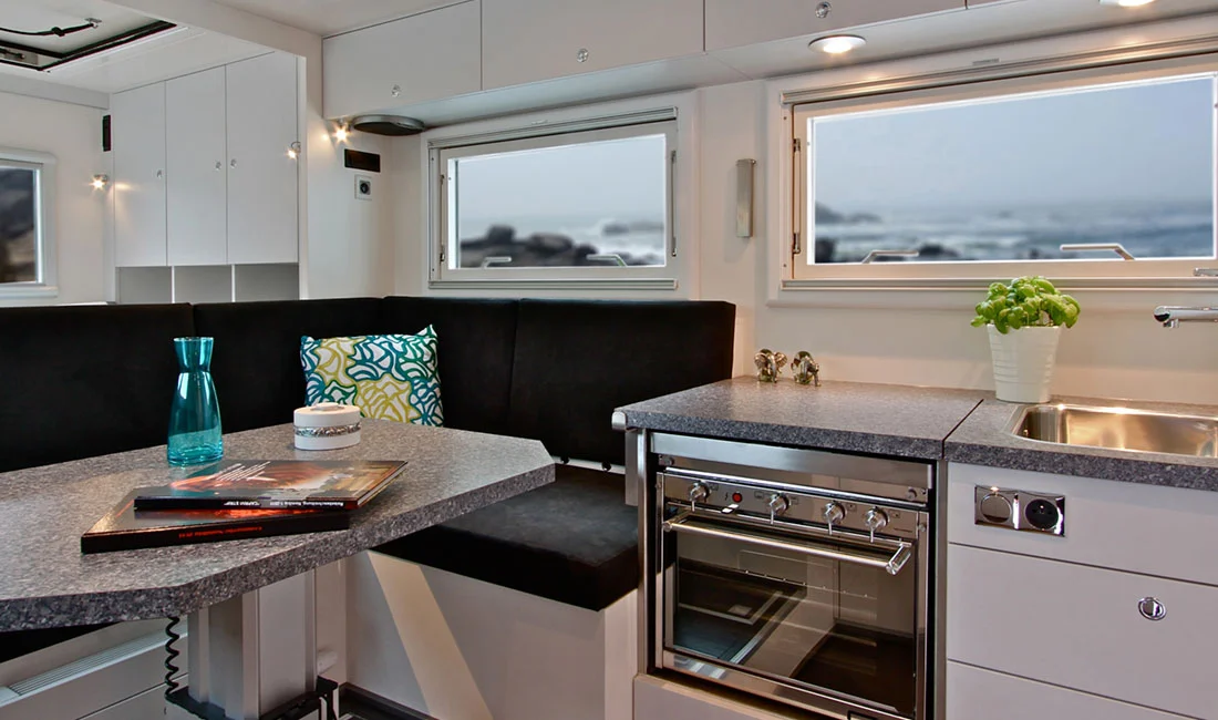 The PURE series includes kitchen areas with cooktops, ovens and stainless steel sinks