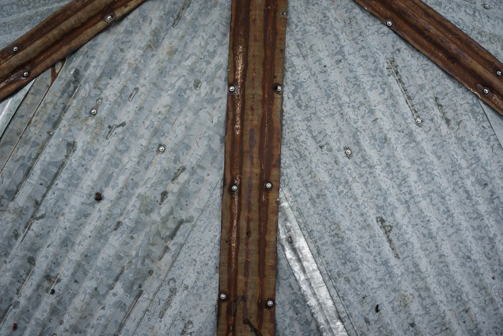 The roofing is built from recycled sheets of metal reclaimed from an old barn (Photo: Ethan Schlussler)
