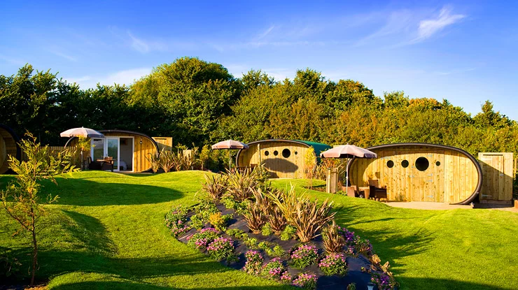The eco-friendly accommodation includes a series of highly insulated eco pods, offering simple comforts surrounded by lush rolling hills