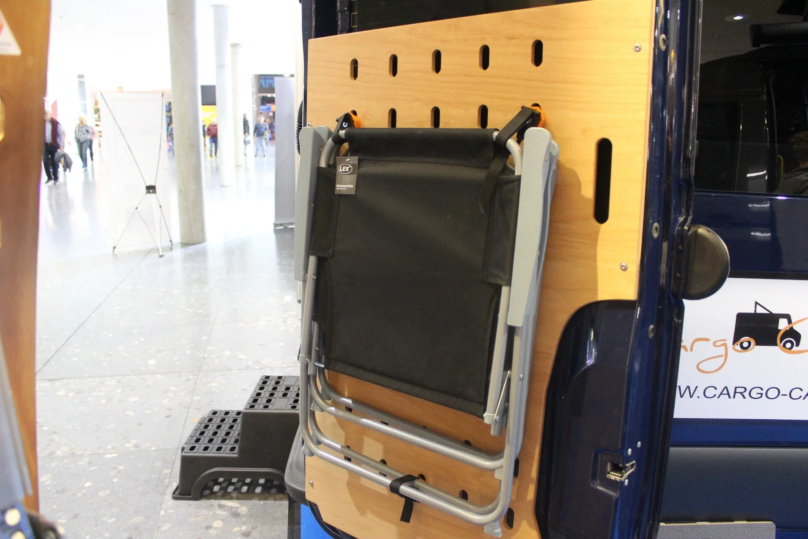 The other rear door of the Cargo Camper City Sprinter holds the chairs