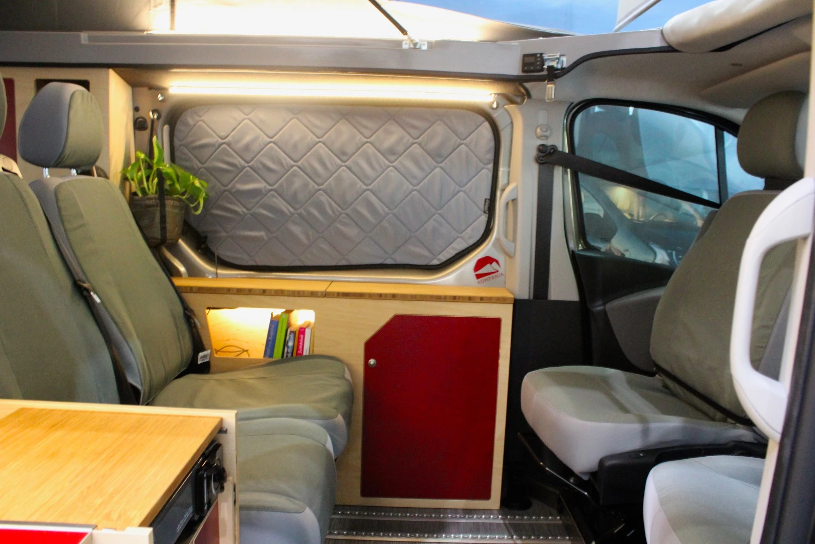 A look at the swivel front seats and the driver-side cabinet unit
