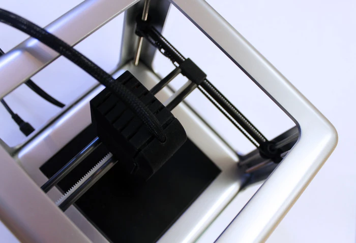 The Micro filament spools are fed from inside the printer, but you can also use an external filament access port located on top of the extruder (Photo: M3D)