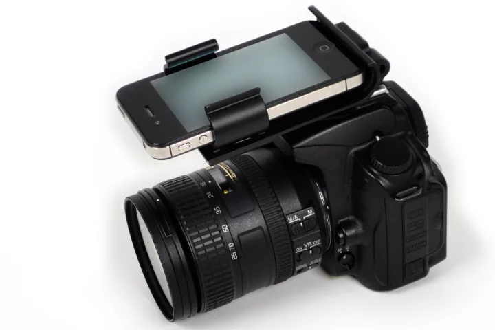 The Flash Dock from Pocket Demo provides a physical connection between your iPhone and DSLR camera via the latter's hot shoe socket, providing ready access to your library of photography apps