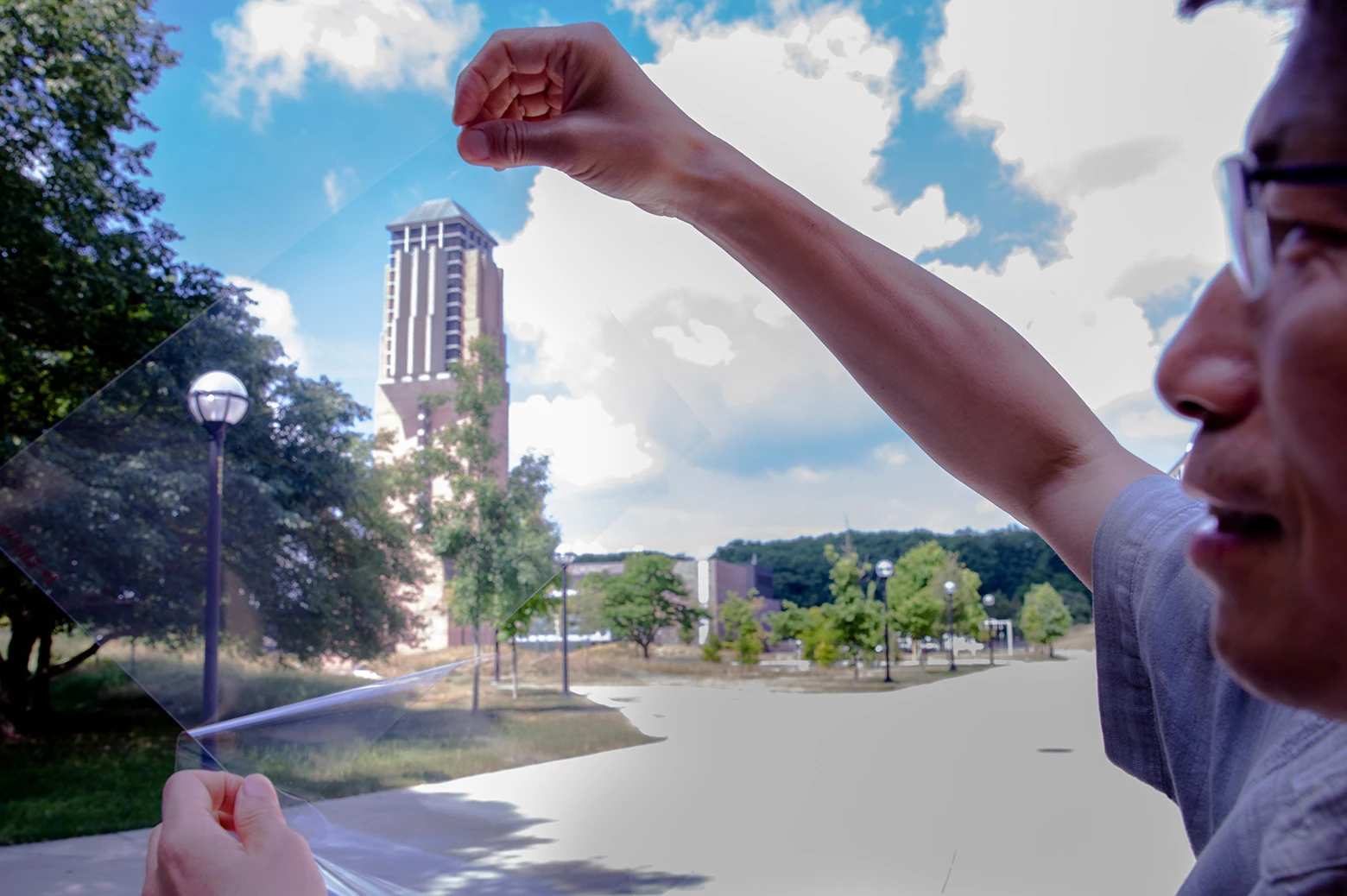 Lead researcher Jay Guo holds up a sheet of flexible transparent conductor