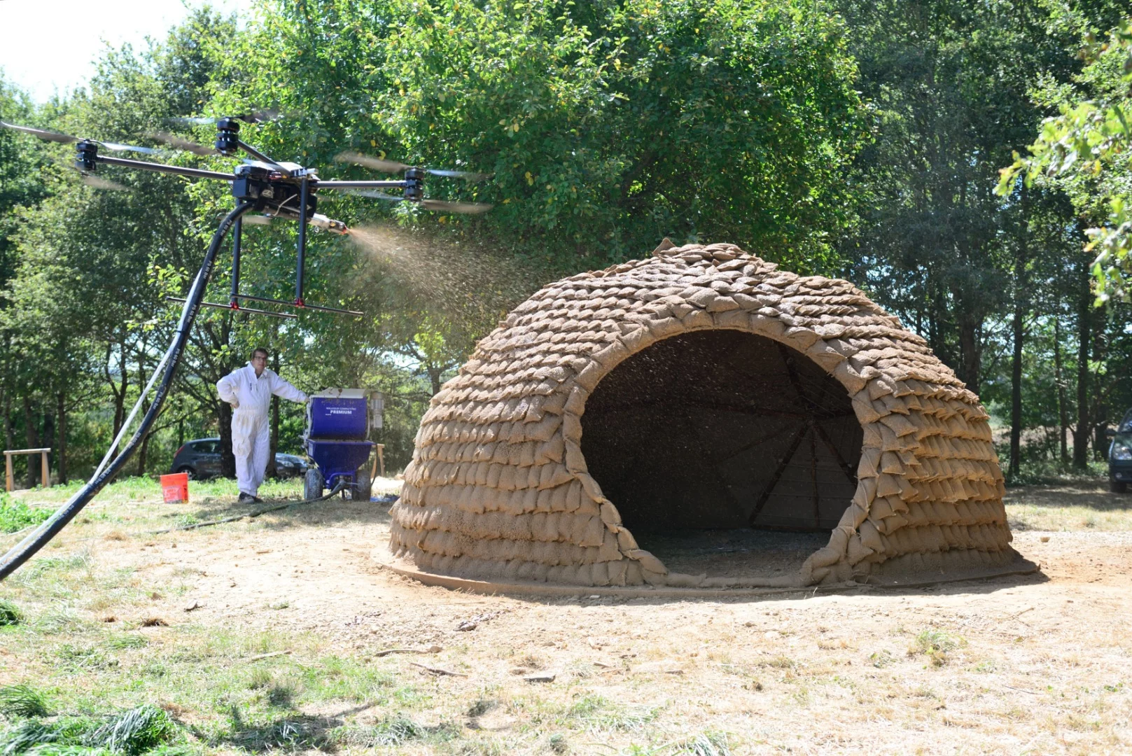 Researchers hope to fit drones with spraying hoses to apply layers of biomaterials onto light structures, such as geodesic dome frames or grid shells covered in tensile fabrics