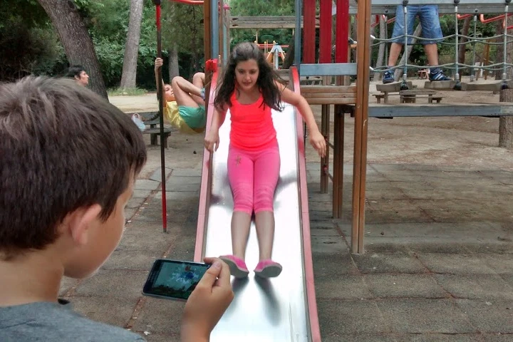Hybrid Play fuses playground time with mobile games by turning swings and slides into game controllers