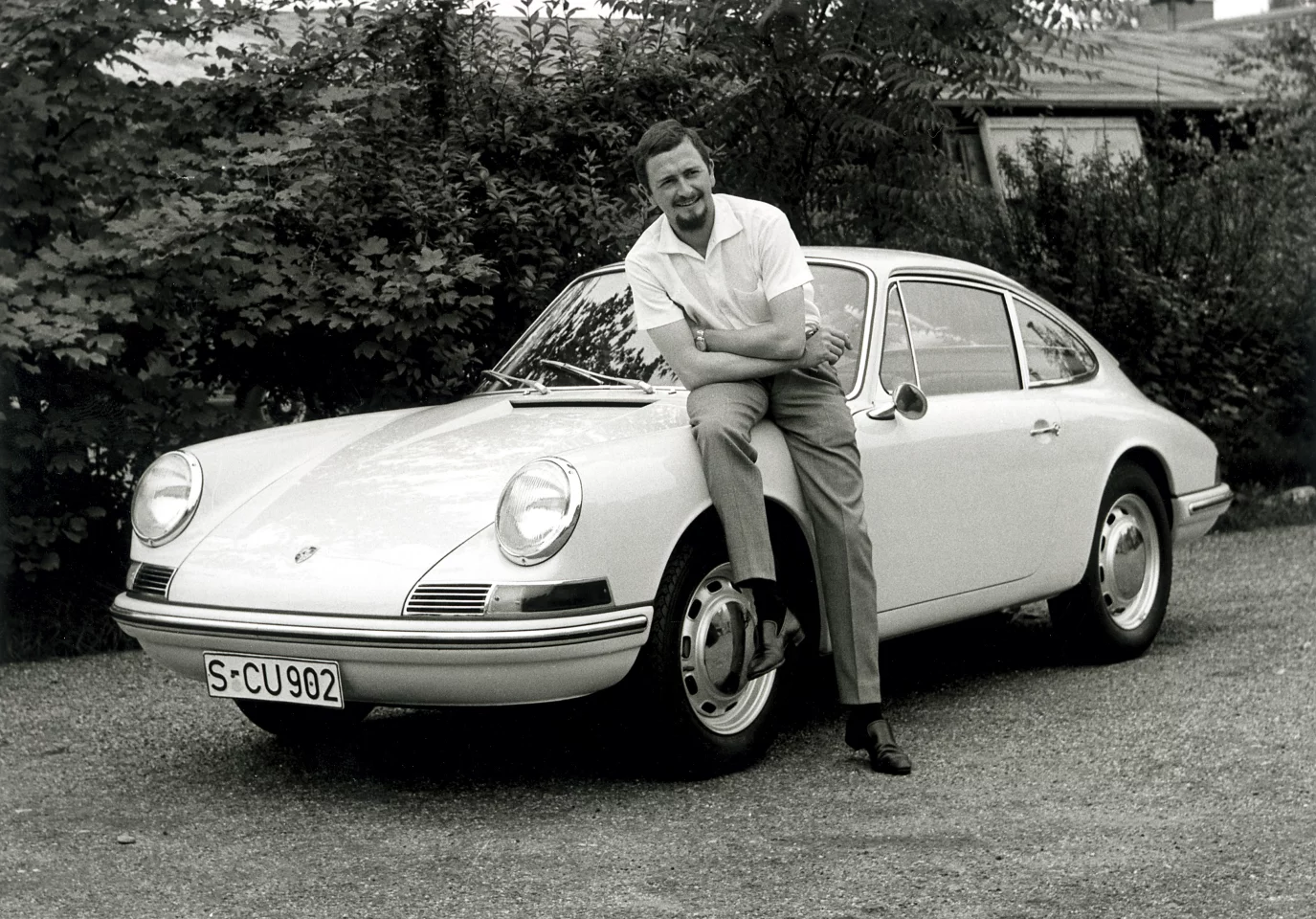 Ferdinand Alexander Porsche with the car he designed